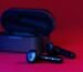 black and gray bluetooth earbuds